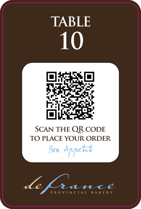 Restaurant QR code table ordering system showing a customer scanning a QR code at their table